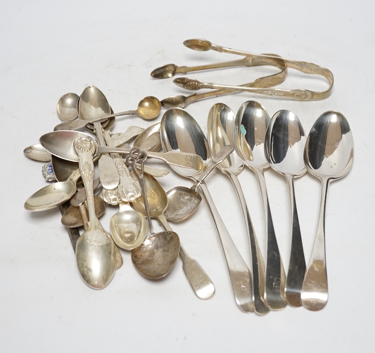 A small quantity of assorted silver flatware including a pair of George III silver Old English pattern table spoons by Elizabeth Tookey, London, 1767 and a set of three similar table spoons by Eley & Fearn, London, 1808,